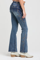 Grace in LA rhinestone jeans for women featuring a crystal-embellished feather embroidery on the front pocket.