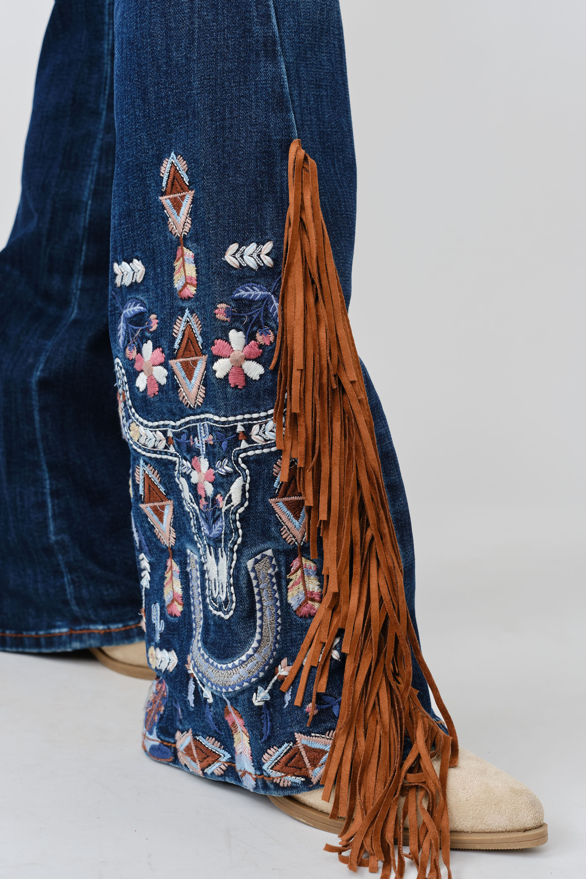 Grace in LA women's medium wash bootcut jeans, front view featuring decorative western-inspired embroidery