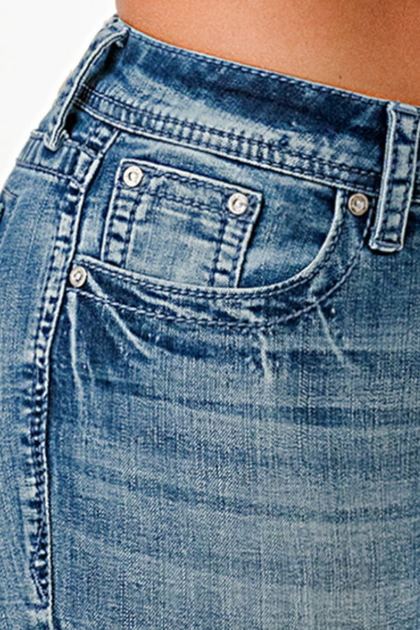 Grace in LA womens bootcut jeans in a medium blue featuring white ornate wing-inspired embroidery on the back pockets.