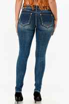 Grace in LA western jeans for women featuring a slim fit silhouette with a medium wash and distinctive triple-arch back pocket stitching.