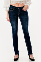 Grace in LA womens bootcut jeans in a dark wash with subtle whiskering and decorative contrast stitching on the front pockets.