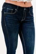 Grace in LA womens bootcut jeans in dark indigo denim with distinct white contrast stitching and a whiskered finish.