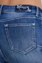 Grace in LA women's medium wash flare jeans in a contemporary boho silhouette with floral embroidery down the leg