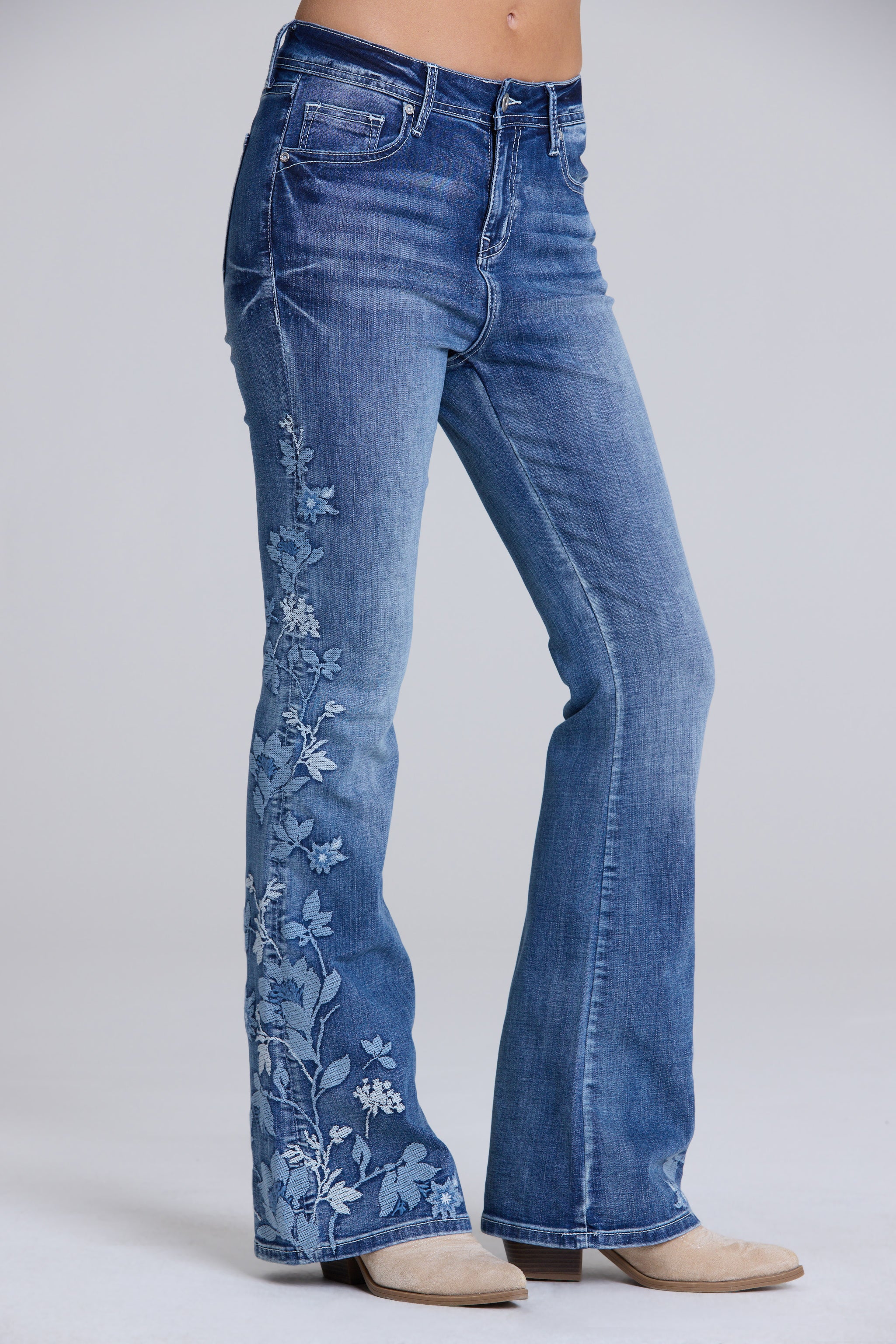 Grace in LA women's flare jeans back pocket detail featuring floral embroidery on medium wash denim