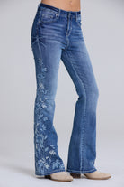 Grace in LA women's flare jeans back pocket detail featuring floral embroidery on medium wash denim