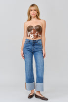 Grace in LA women's medium wash flare jeans styled with a fitted silhouette and flared leg