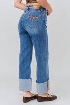 Grace in LA women's medium wash flare jeans, side-facing view with a fitted hip and flared leg