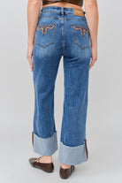 Grace in LA women's medium wash flare jeans, full-length front view showing the fitted silhouette and flared leg