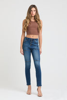 Grace in LA high rise skinny jeans for women in a medium blue featuring horizontal knee panel stitching and a multi-button waist.