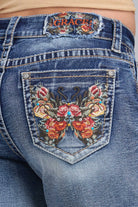 Grace in LA denim shorts back pocket detail featuring butterfly and floral embroidery