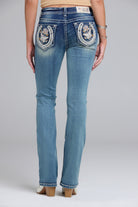 Grace in LA bootcut jeans close-up of horse shoe and floral embroidery on medium wash denim