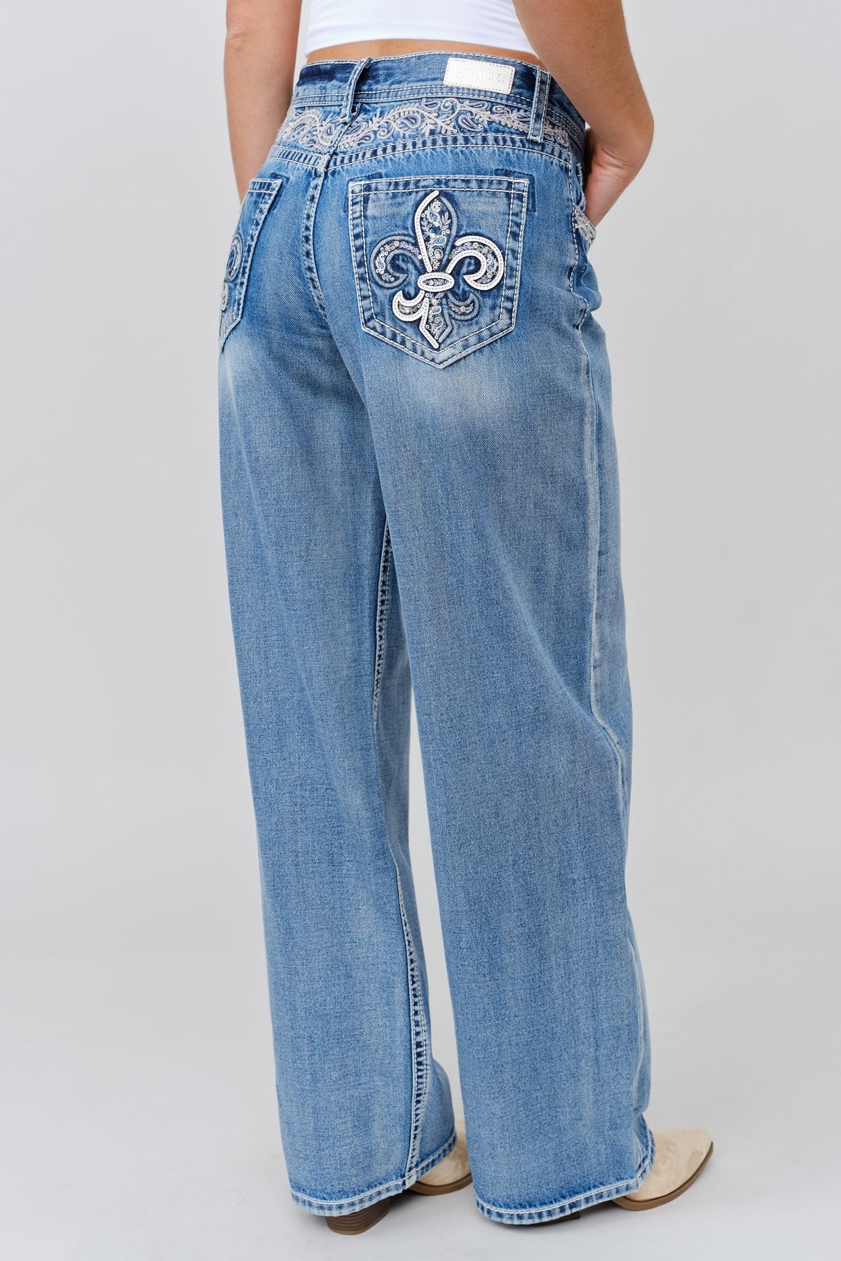 Grace in LA women's light wash wide leg jeans full rear view with symmetrical embroidered leather applique with yoke on both back pockets