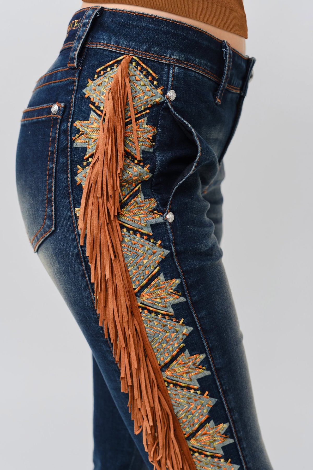 Grace in LA women's dark wash cowgirl jeans styled with boots