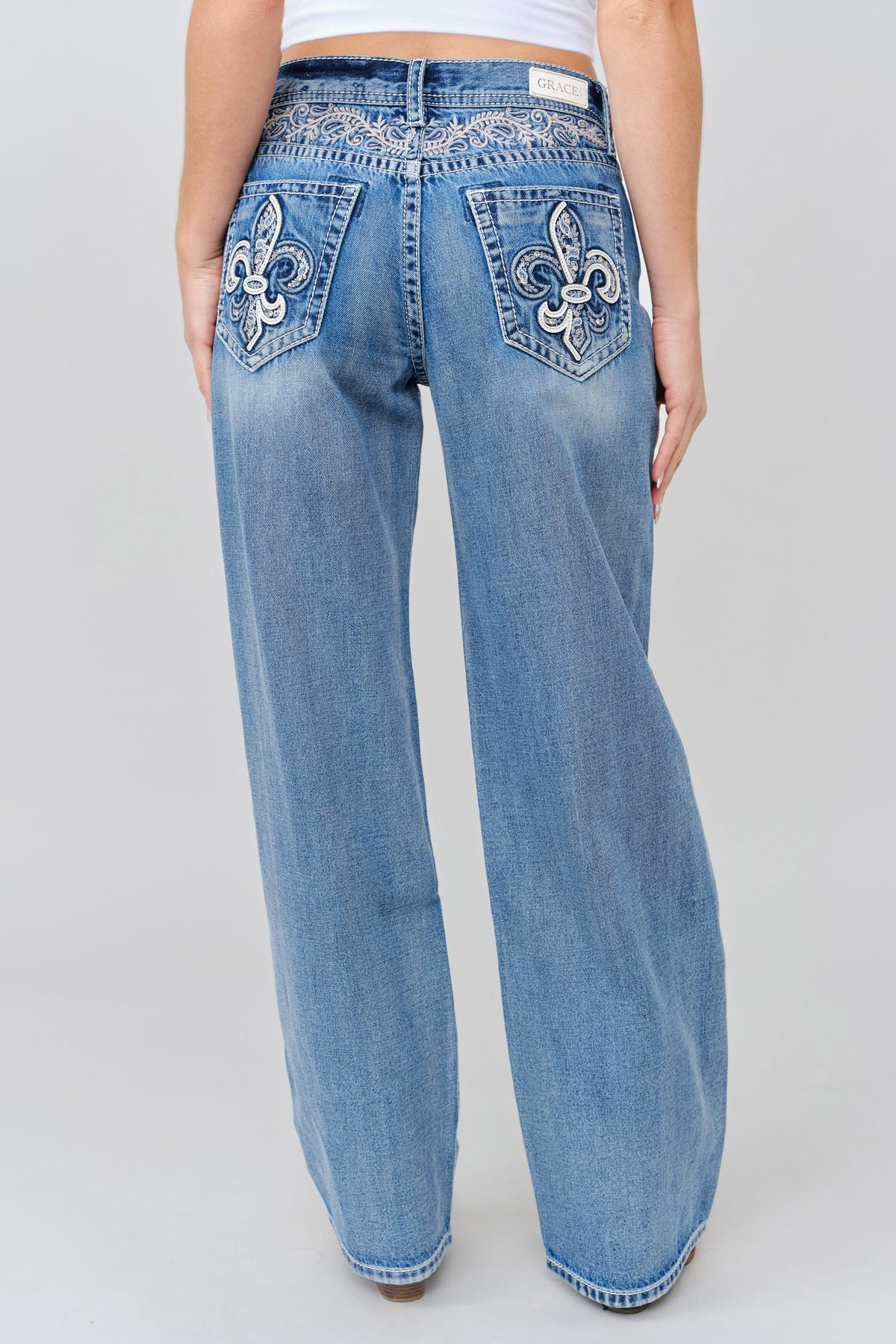 Grace in LA women's light wash embroidered leather applique with yoke wide leg jeans styled for a western-inspired look