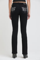 Grace in LA black bootcut jeans side view showing chandelier motif placement