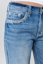 Grace in LA wide leg jeans close-up of embroidered leather applique with yoke on light wash denim