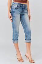Grace in LA women's medium wash floral yoke with faux flap design capri jeans styled for a western-inspired look