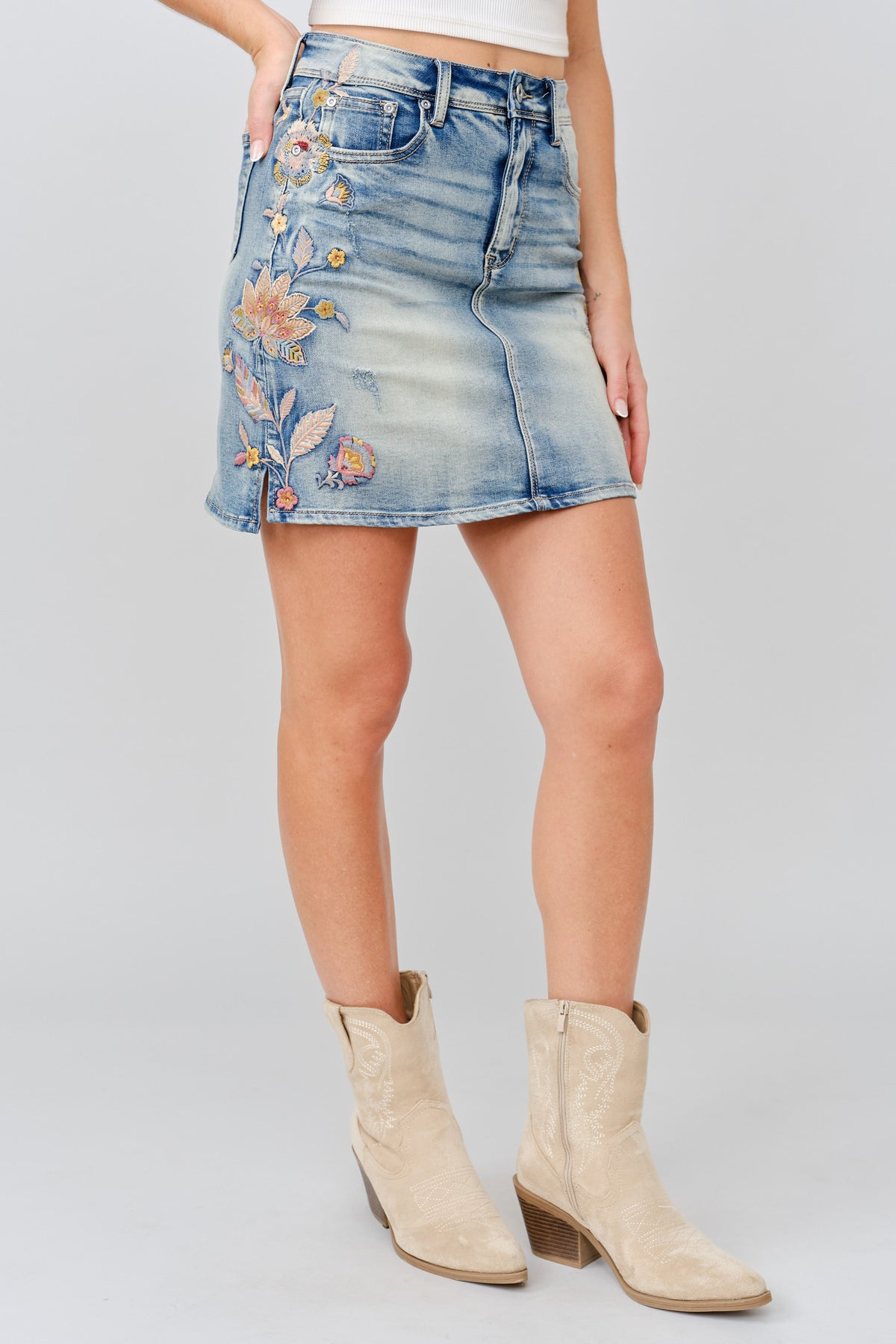 Grace in LA women's light wash floral colored embroidery denim skirt styled for a western-inspired look