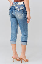 Grace in LA women's medium wash capri jeans in a slim western silhouette with floral yoke with faux flap design