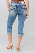 Grace in LA women's medium wash floral yoke with faux flap design capri jeans styled for a western-inspired look