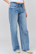 Grace in LA wide leg jeans close-up of embroidered leather applique with yoke on light wash denim